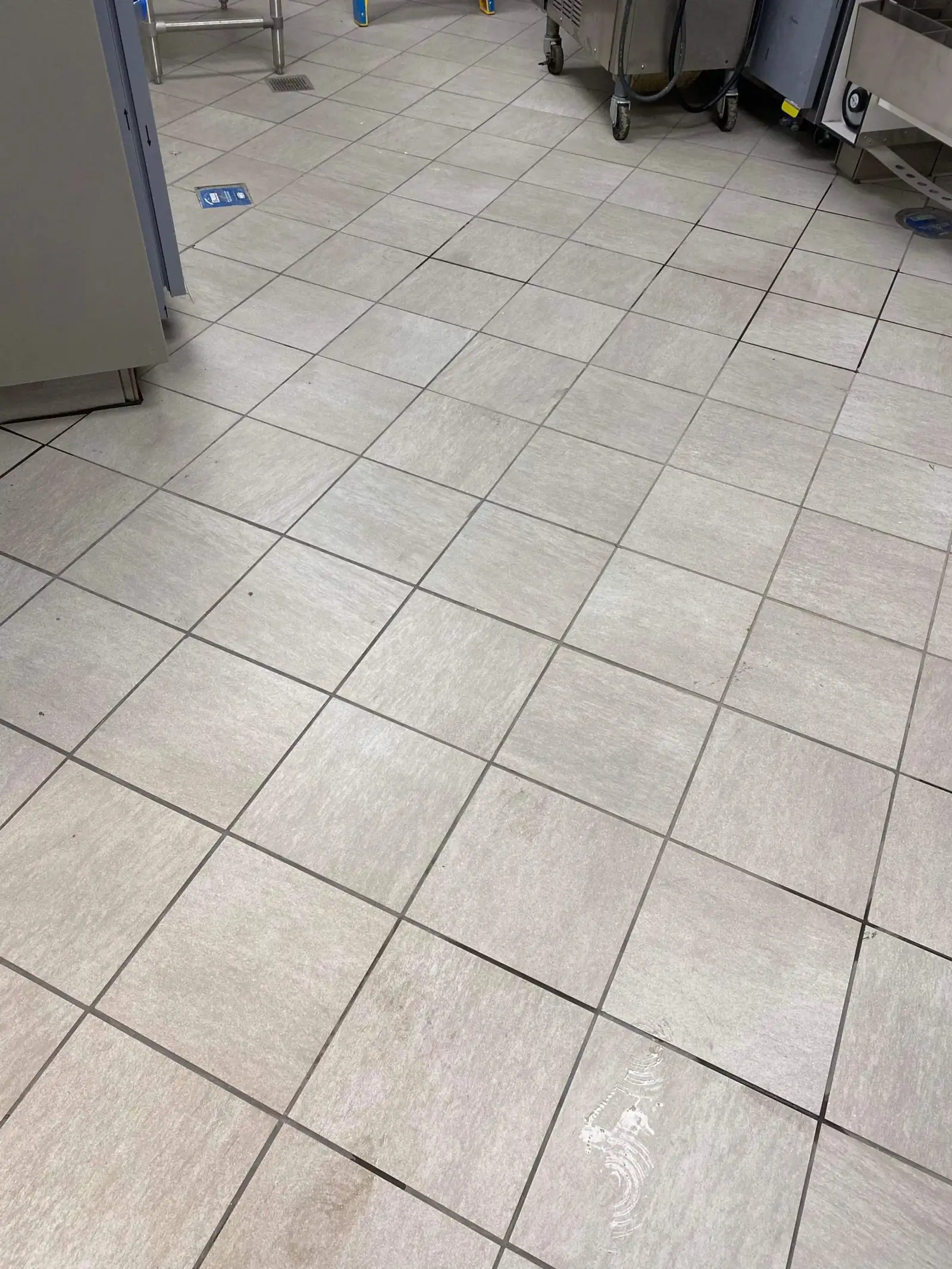 Polished light tile flooring in a cleaned commercial interior