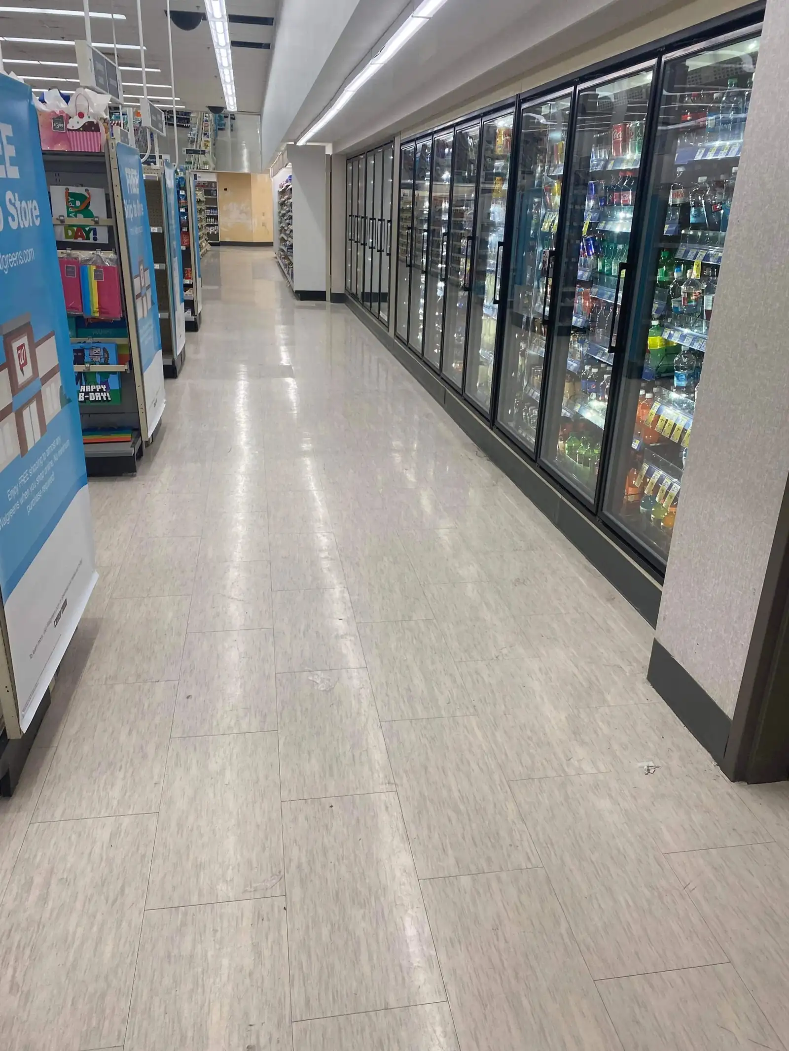 Long polished retail concourse floor after scheduled floor care service
