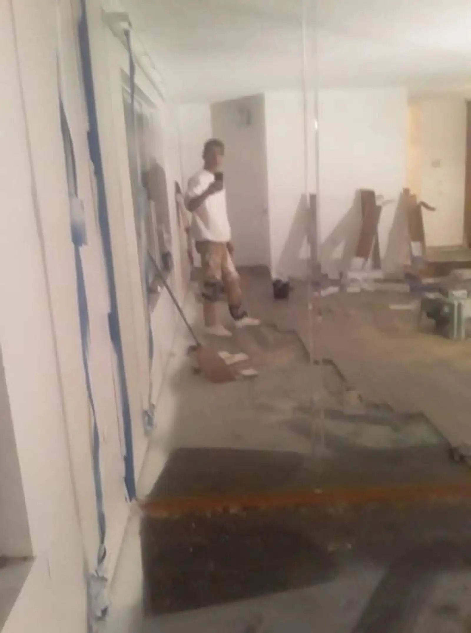Crew member cleaning a newly finished commercial interior