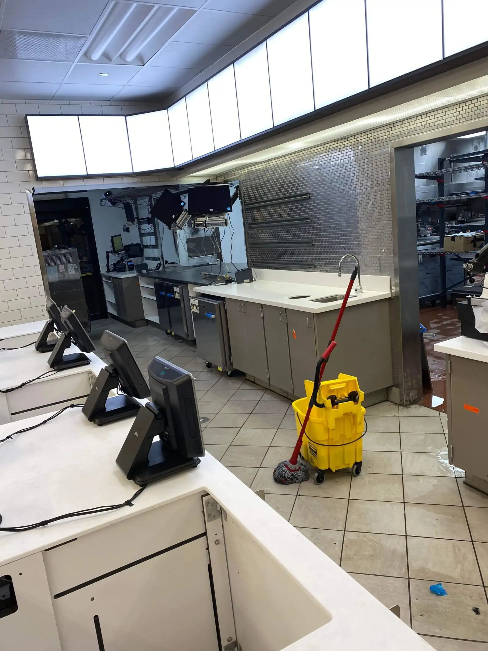 Habibi's crew performing a deep clean of a commercial restaurant kitchen